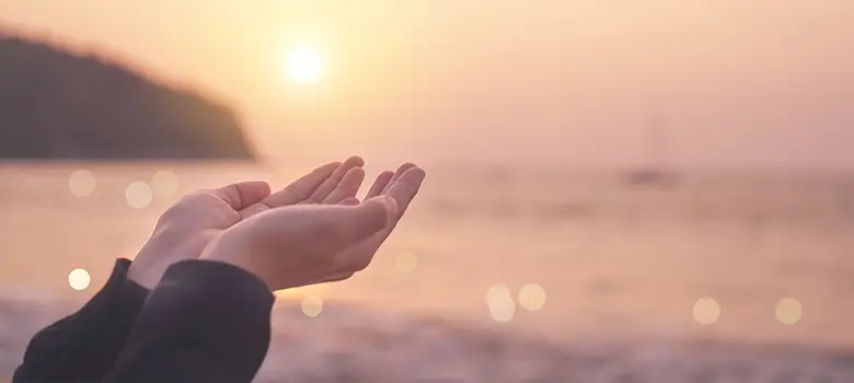 lost angels environment person praying beach sunset enviroment