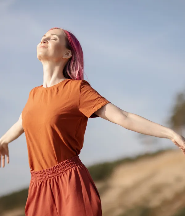lost angels environment woman pink hair orange dress standing hill