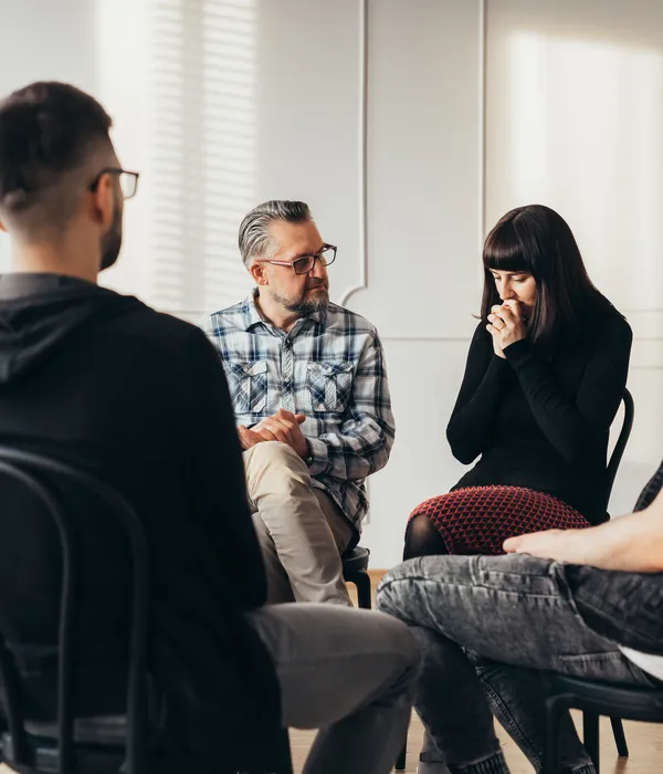lost angels group therapy people sitting around table talking