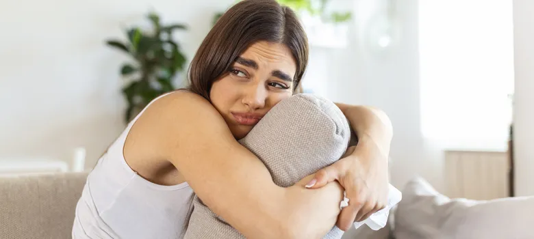 lost angels mental health woman sitting couch arm resting pillow