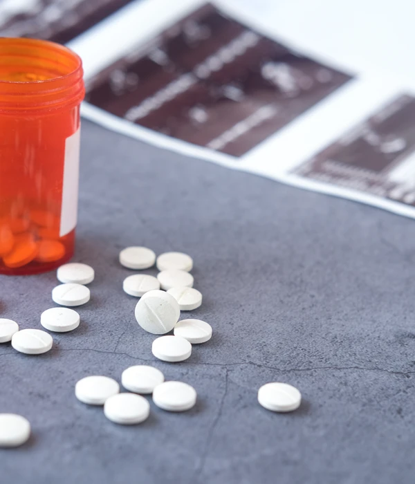 lost angels opioid pills spilling out bottle