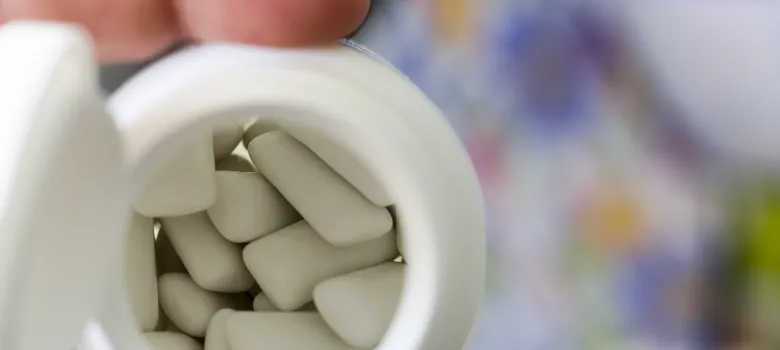 lost angels prescription drug person holding pill hand