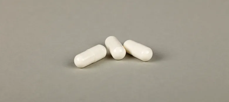 lost angels prescription drug two white pills gray background awe