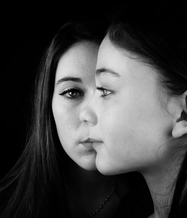 close-up-girl-young-woman-against-black-background-page