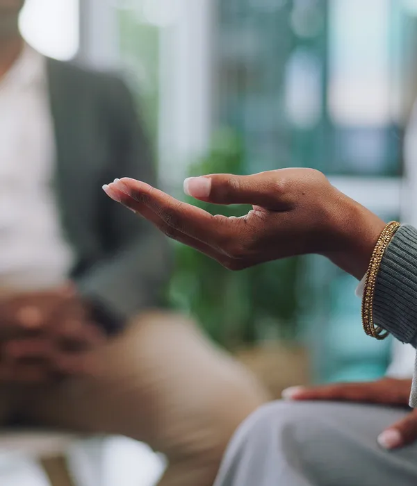 lost-angels-therapy-woman-sitting-couch-hand-out-someone-page