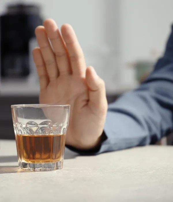 man-rejecting-glass-alcohol-indoors-page