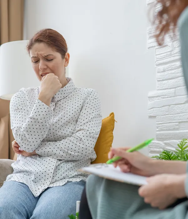 young-woman-using-phone-while-sitting-sofa-home-page-1