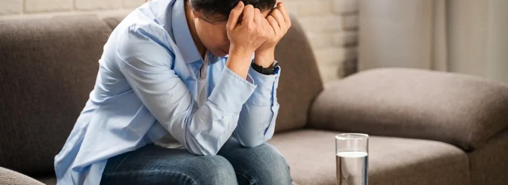 Young adult struggling with during alcohol withdrawal.