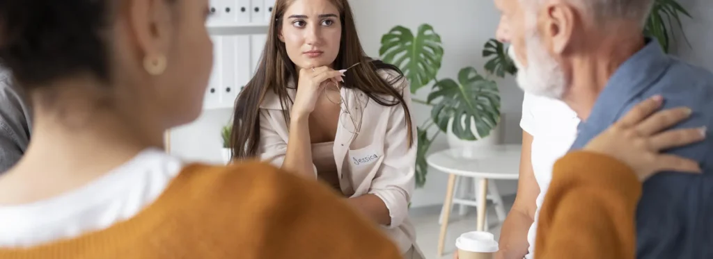 Therapist listening to the patient talk about alcohol withdrawal symptoms.