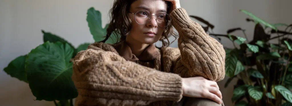 Woman thinking about alcohol detox. 